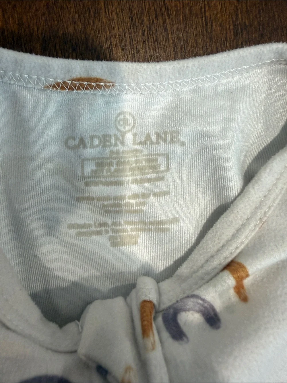 Caden Lane Cream Footed One-Piece with Rainbow Print